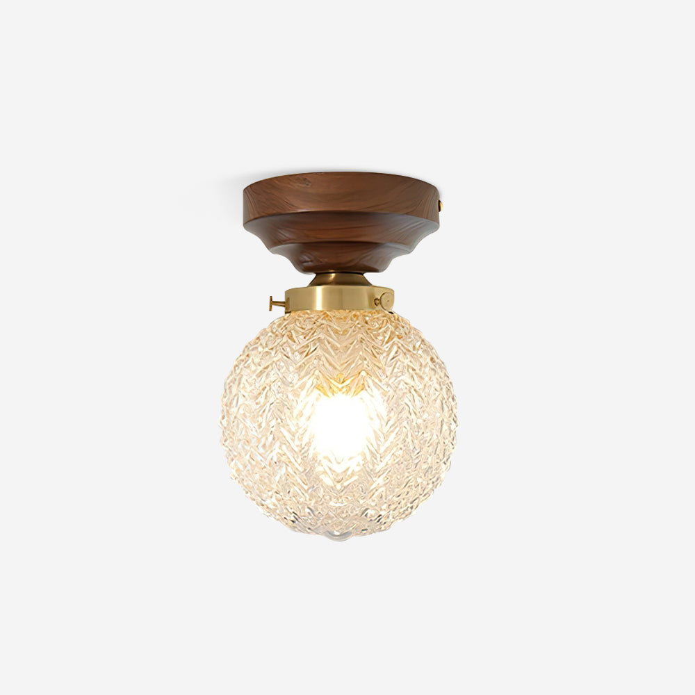 Lampada da soffitto in vetro chiaro, rosone in ottone e paralume sferico in legno noce