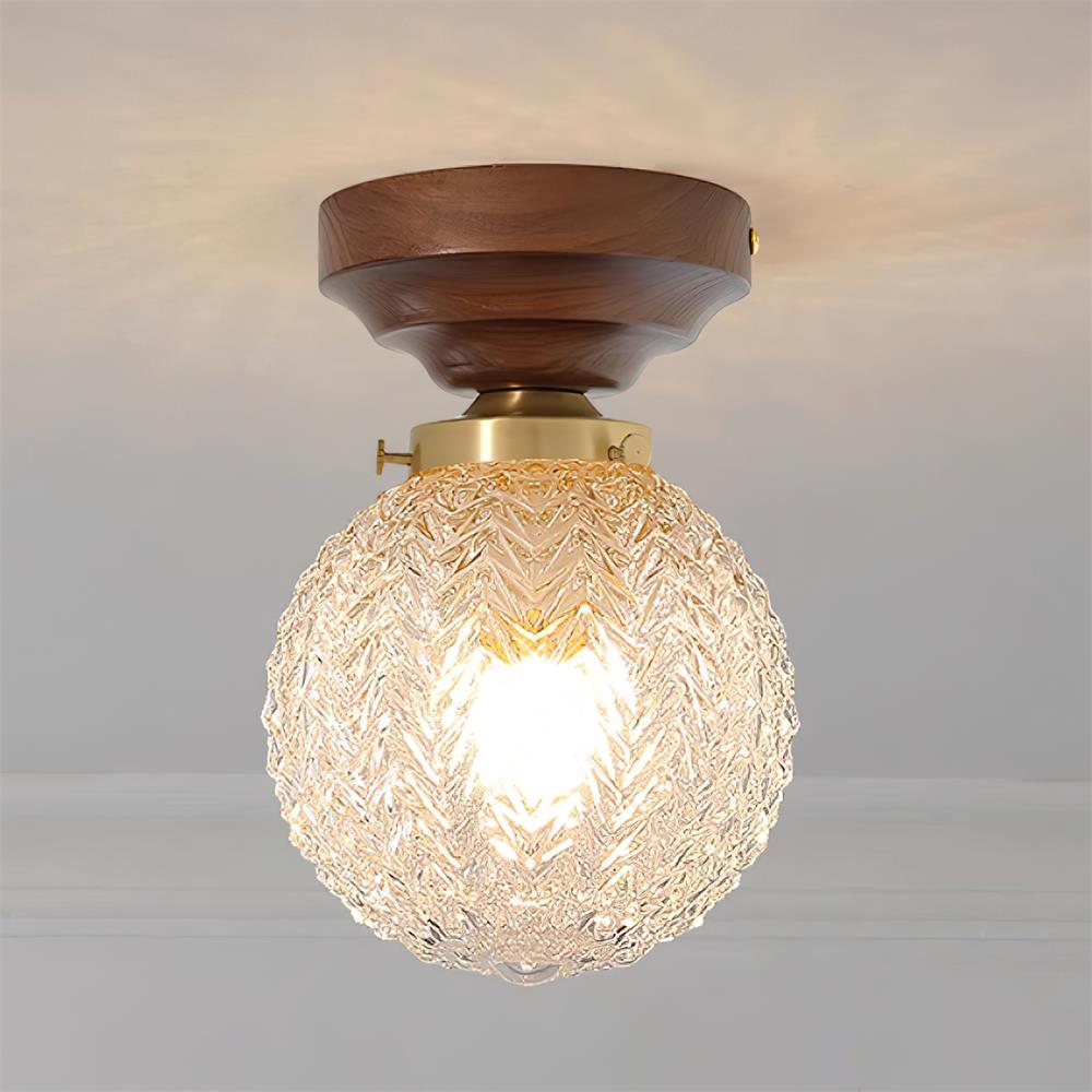 Lampada da soffitto in vetro chiaro, rosone in ottone e paralume sferico in legno noce