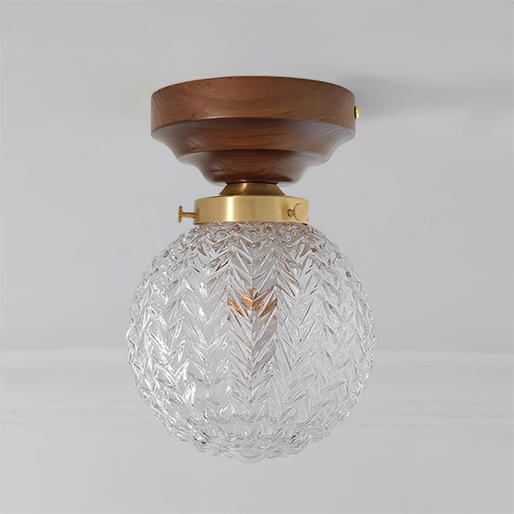 Lampada da soffitto in vetro chiaro, rosone in ottone e paralume sferico in legno noce
